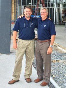 Ed (right) with his brother and IT Manager Curt (left), in front of current major reconstruction of dealership.