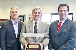 Stillman recognized for 50 years with Volvo: Ed (center) with cousin and Vice President Jerry Wisneski (left), and President and CEO of Volvo Cars N.A. Tony Nicolosi (right).