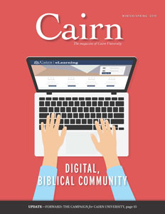 Illustration: On a red/orange background, two hands are typing on a laptop computer. The screen is open to the Cairn elearning page. The photo is advertising the article entitled "Digital, Biblical Community"